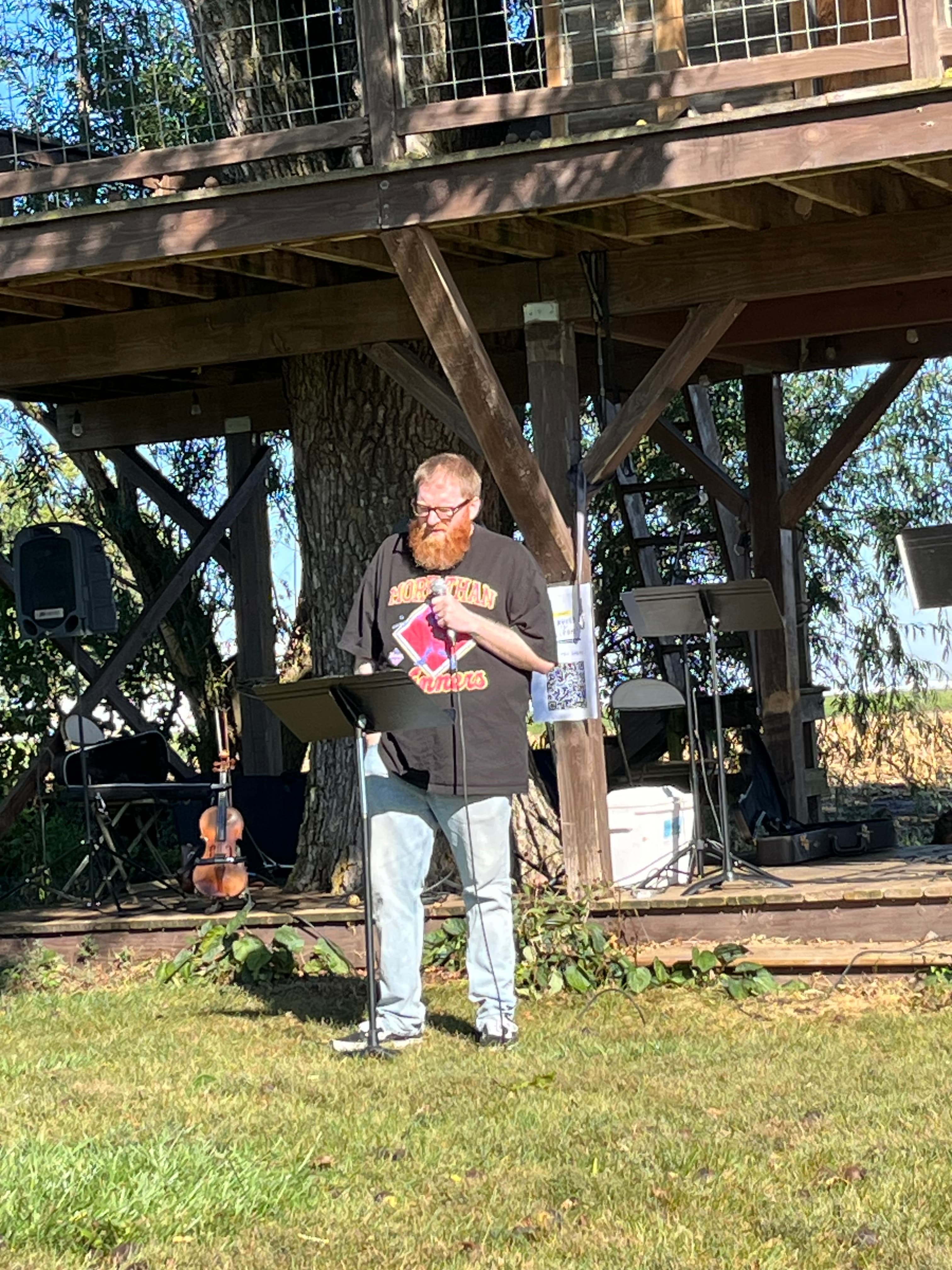 A pastor preaching at an outdoor Church For Pastors gathering at New Hope Church Adel.